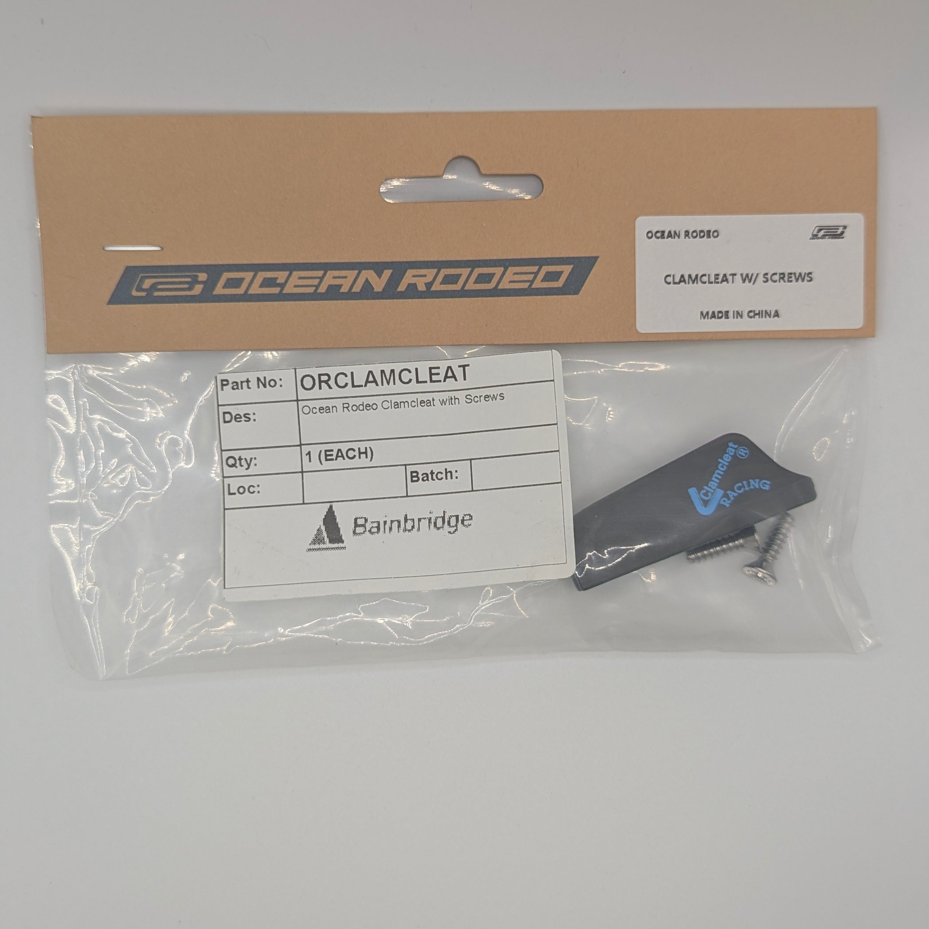 Packaged Ocean Rodeo clamcleat with clear plastic cover on gray background